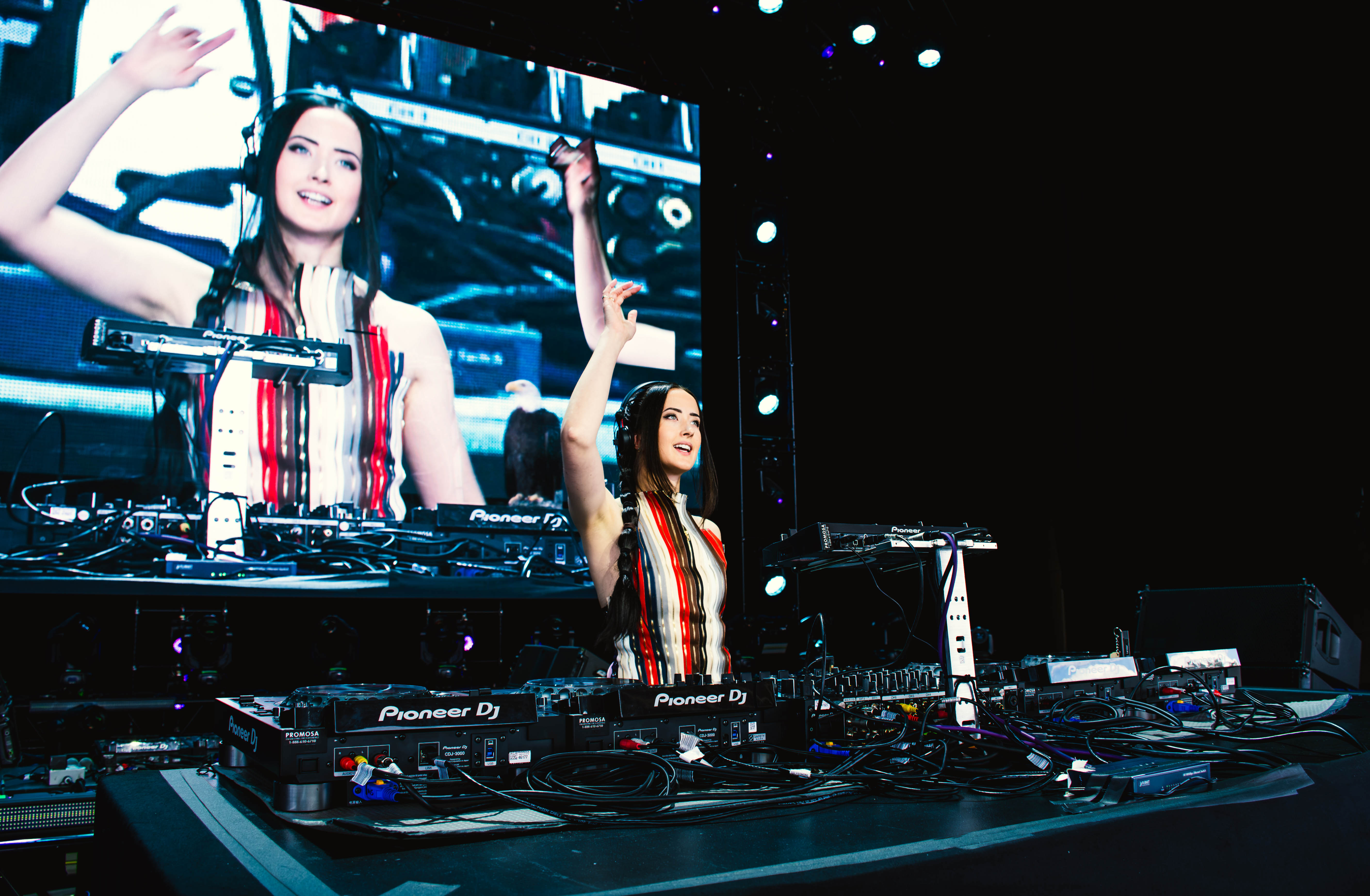 Shades of Day performing at the decks beneath a large stage screen